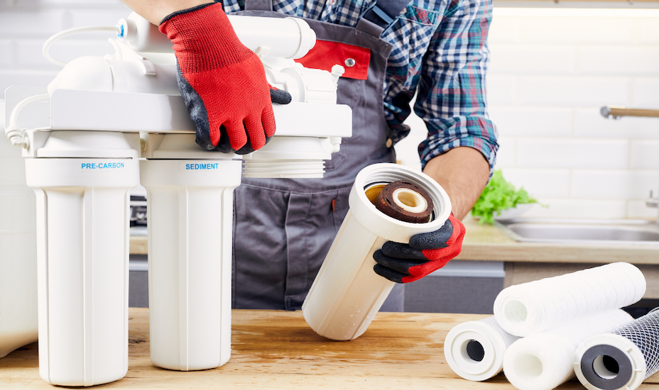 man cleaning water dispenser